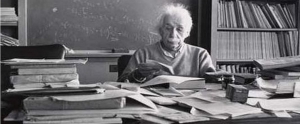 Einstein working at a messy desk